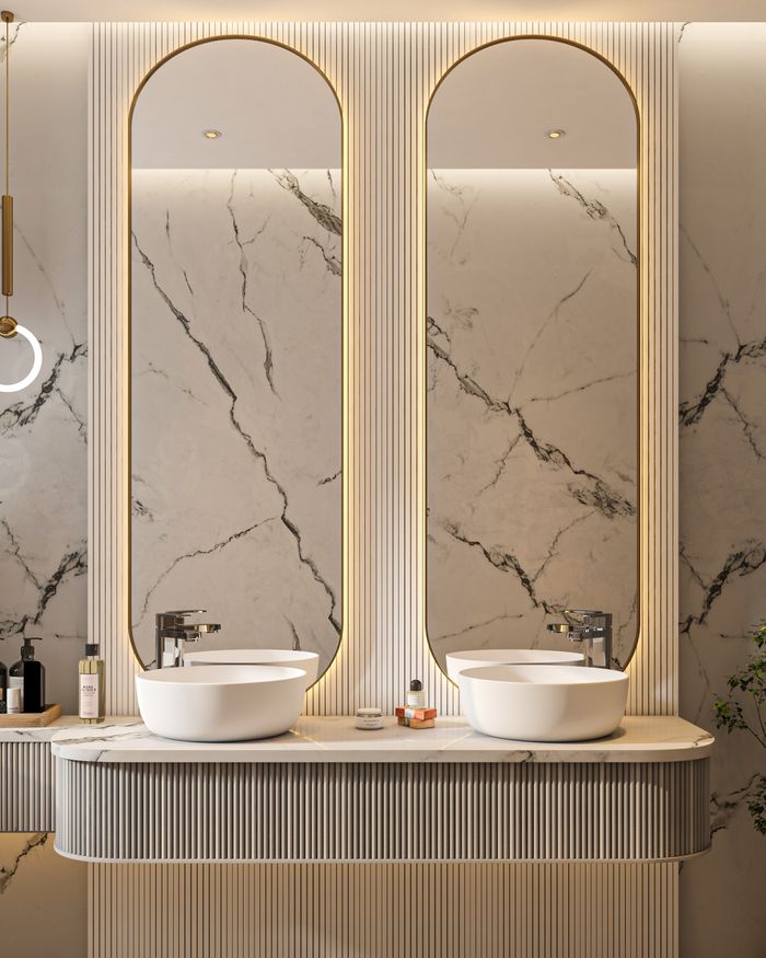 about-01 Elegant marble bathroom with twin sinks and contemporary design elements.